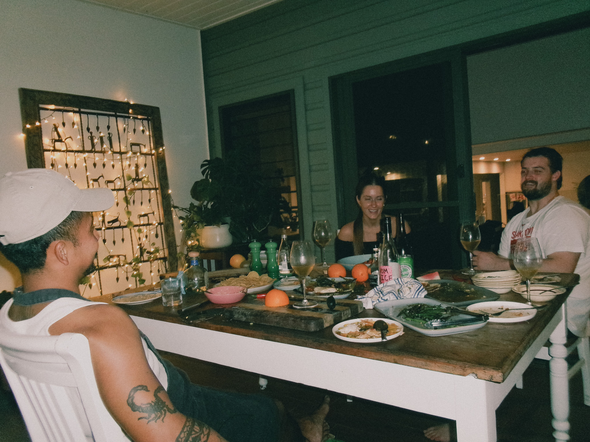 The long table, late and laughing