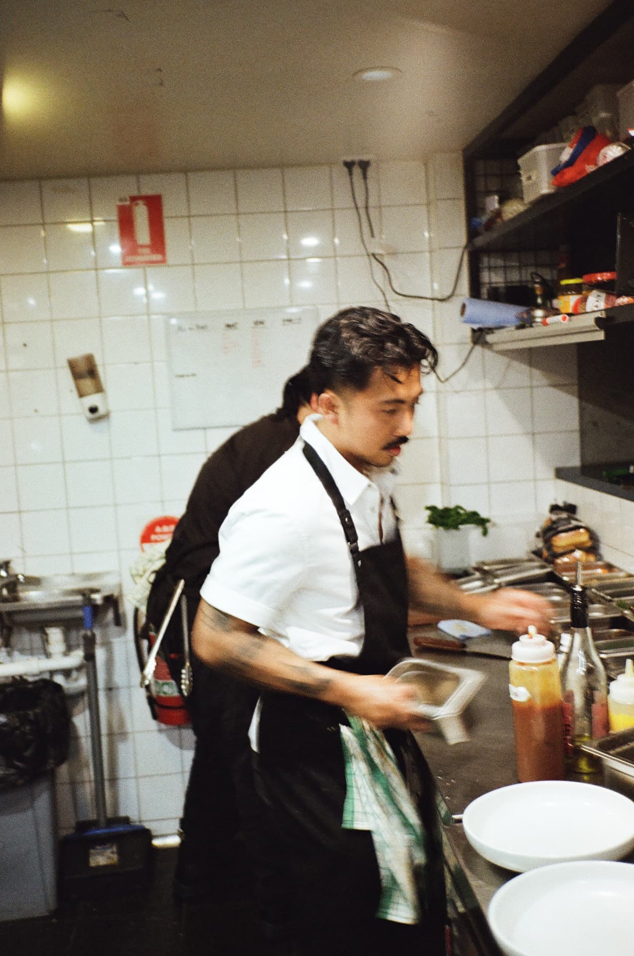 The Boy working service in the kitchen